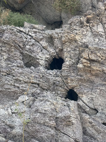 natural holes in a cliff face