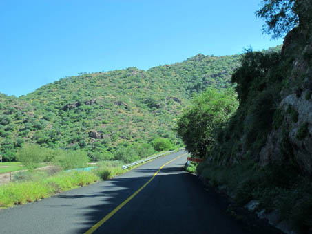 Just south of Loreto along highway with greenery on both sides