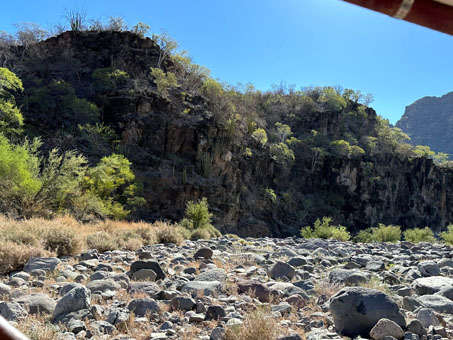 Cliffs with dark gray or black slatelike rock