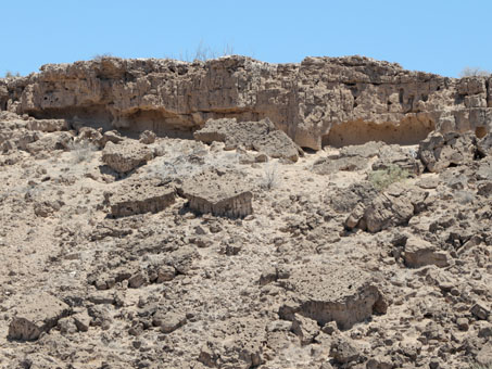 limestone bluff with slabs on hillside